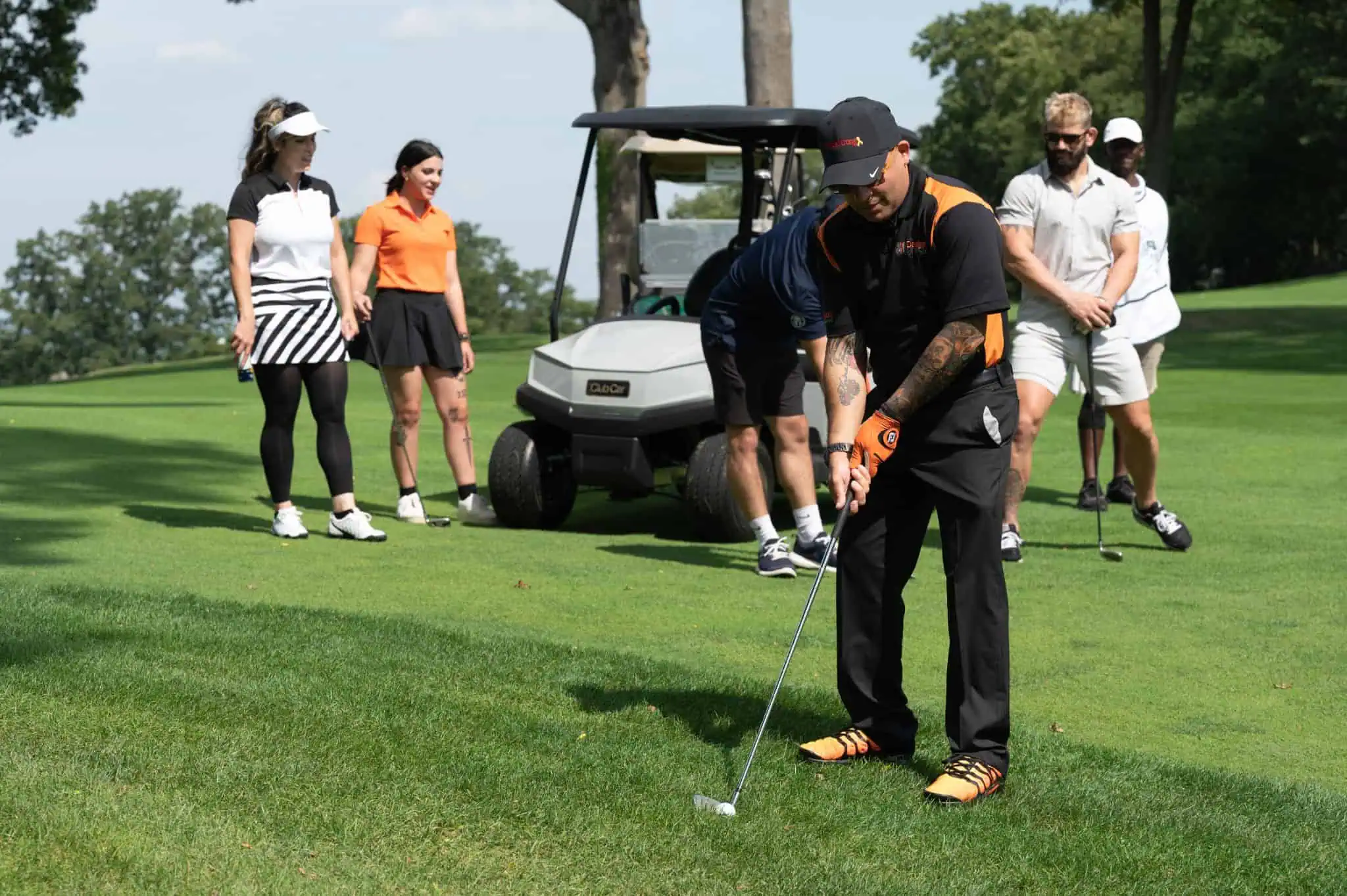 Sean V. Bradley, CSP playing golf with family in the background